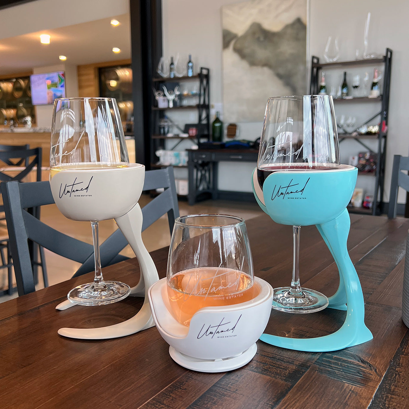 stemmed and stemless wine glasses in vochill wine chillers at winery with winery logos on vochill products